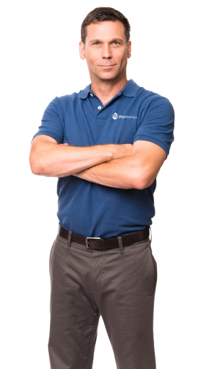 A DryMetrics employee wearing man a company shirt